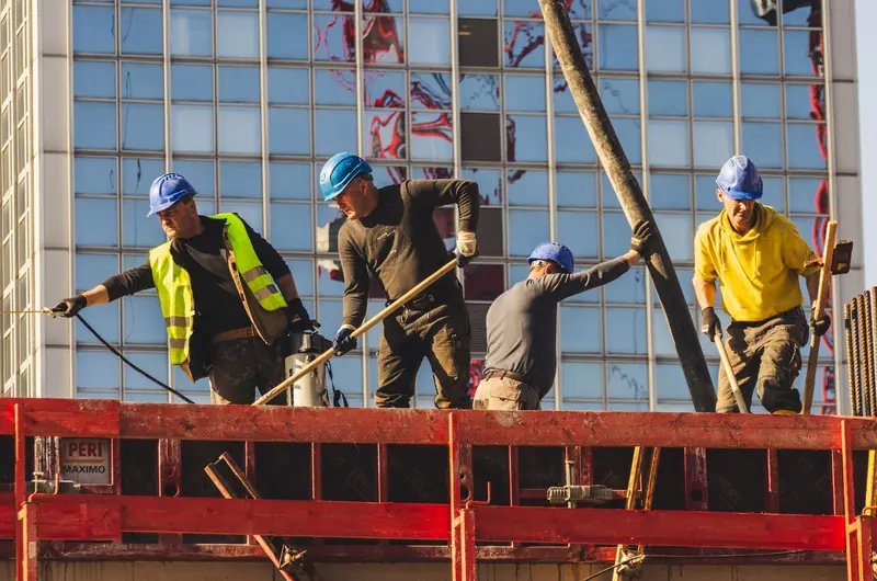 Construction crew in hard hats working on a building project