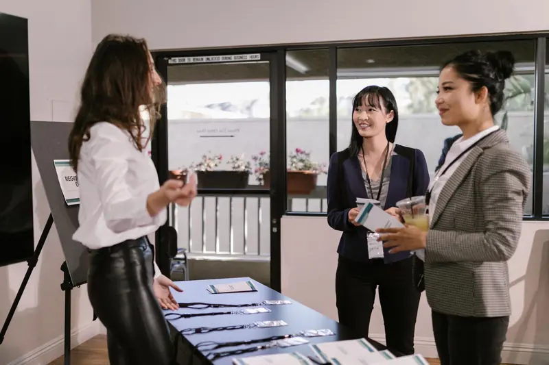 Guests with name badges talking at a company event